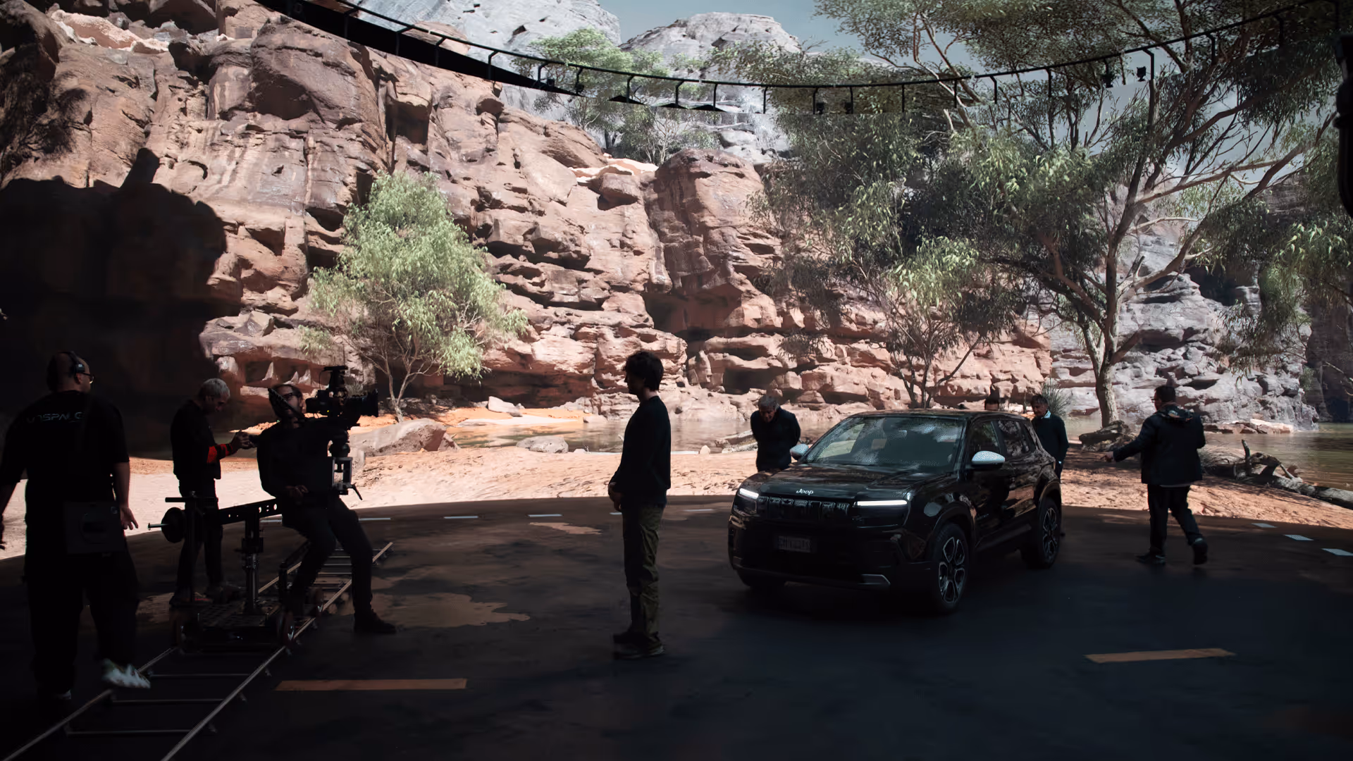Crew filming SUV against canyon walls scanned via photogrammetry inside UNSPACE LED studio.