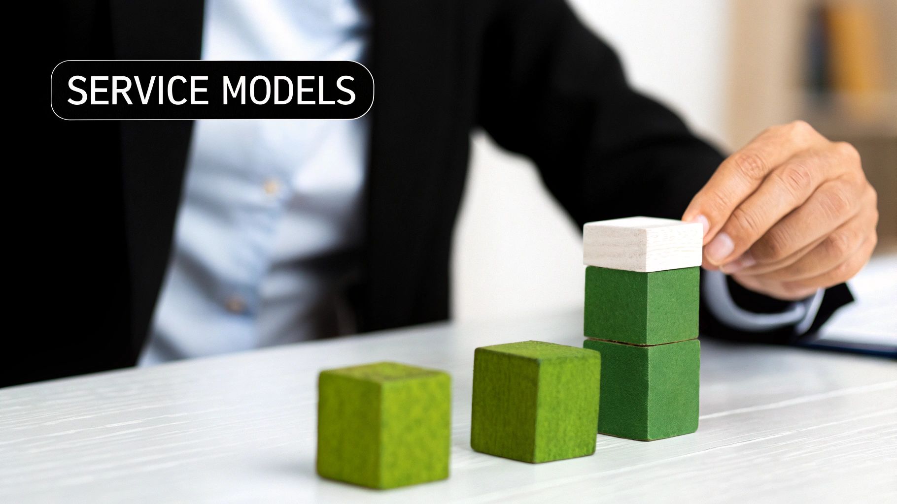 Three diverse professionals discussing service models around a modern office table.