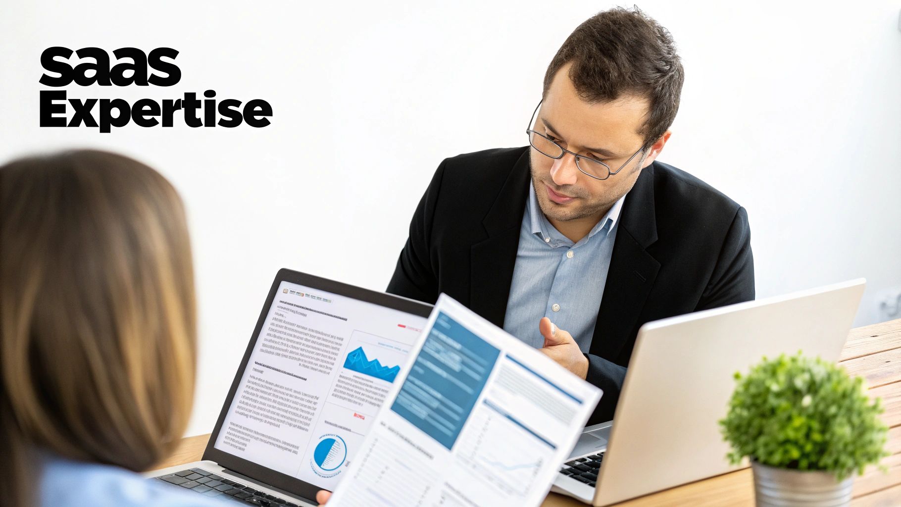 A magnifying glass hovering over a computer screen showing complex data charts, symbolizing the process of vetting a marketing analytics agency.