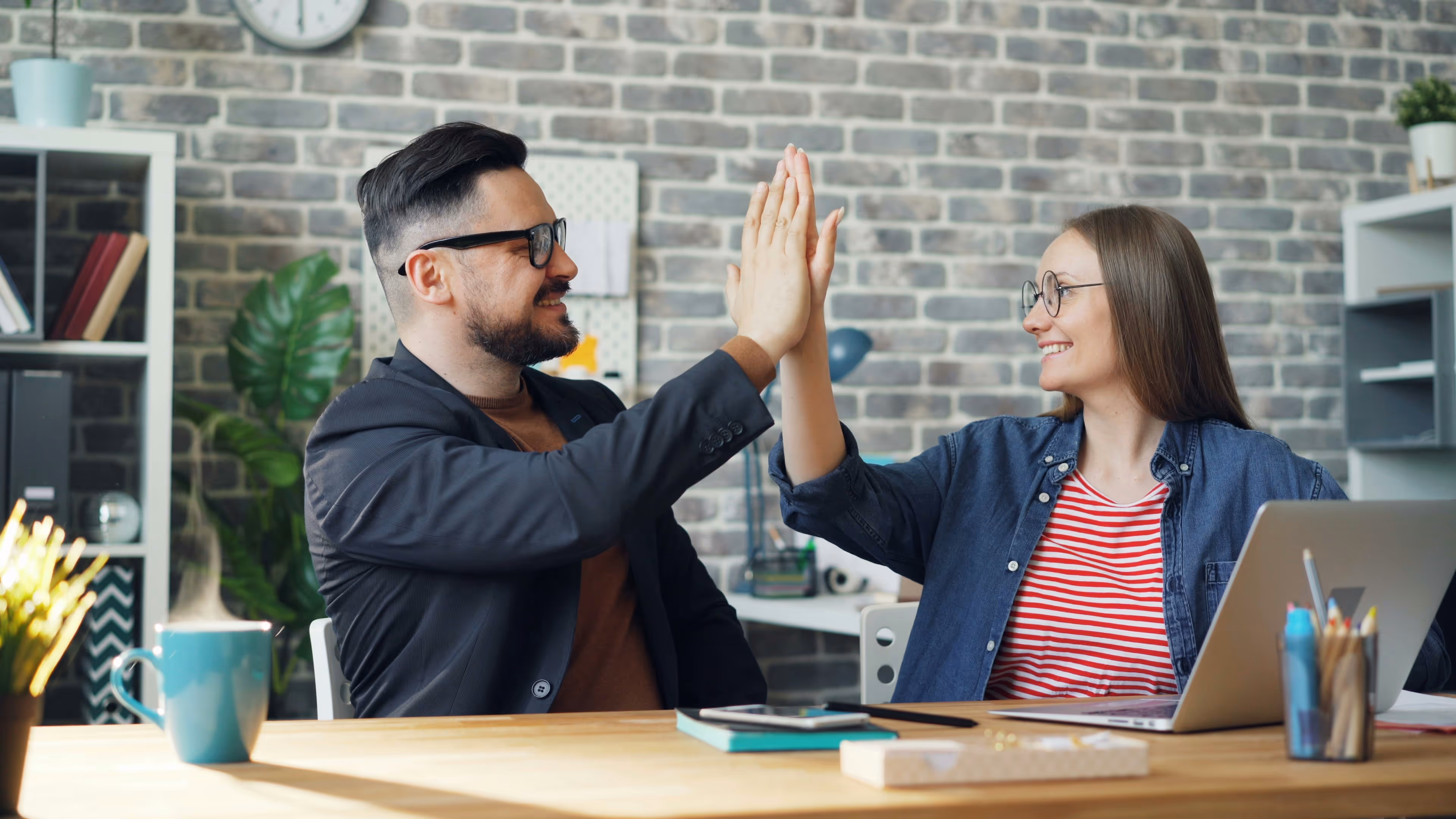 two professionals high-fiving