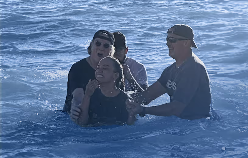 Smiling church members talking and laughing together, representing community growth and fellowship at Colonial Oaks Baptist Church.
