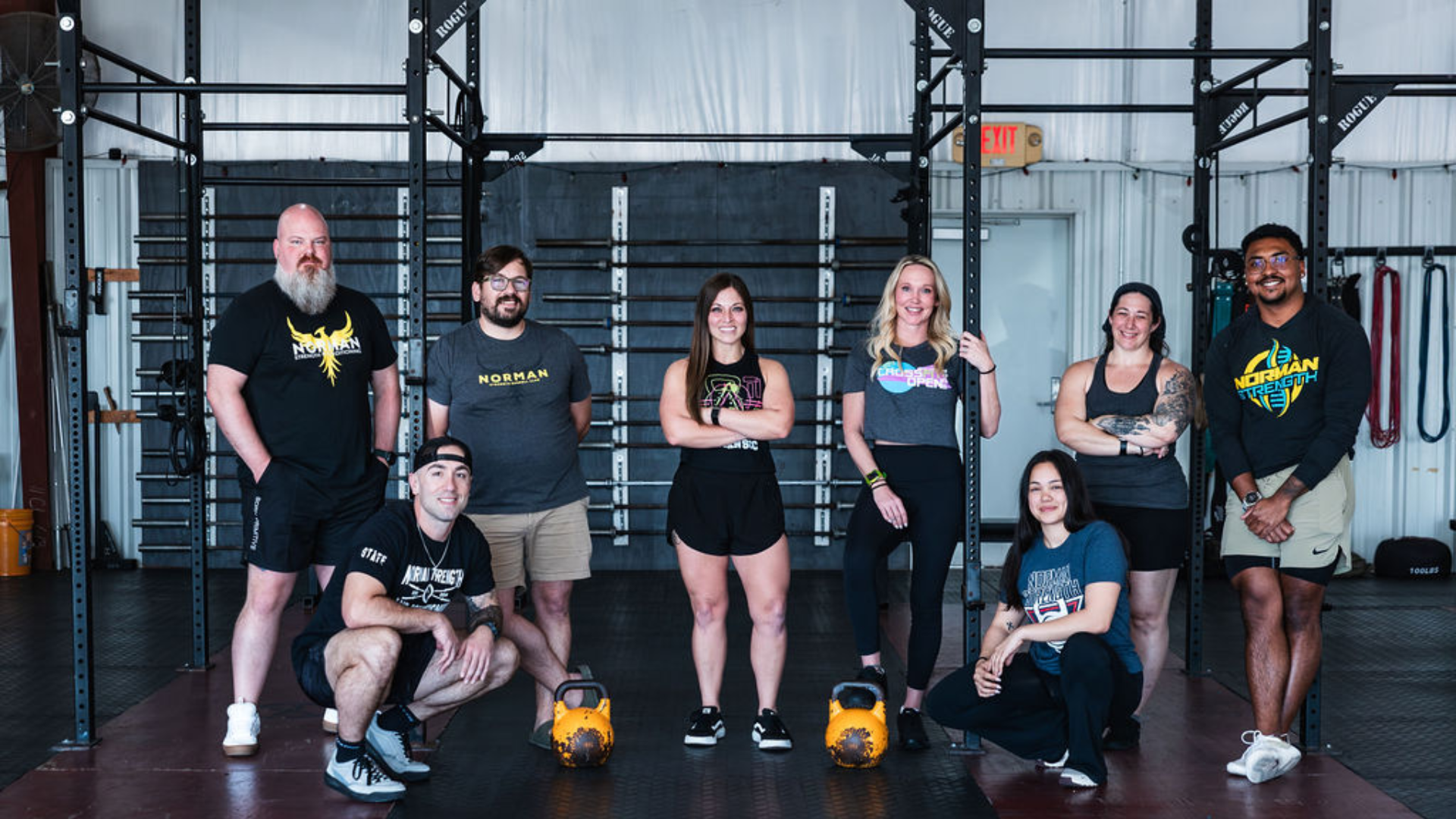 Strength & Conditioning gym interior at Norman Strength & Conditioning in Norman, OK, featuring workout equipment and athletes in action.