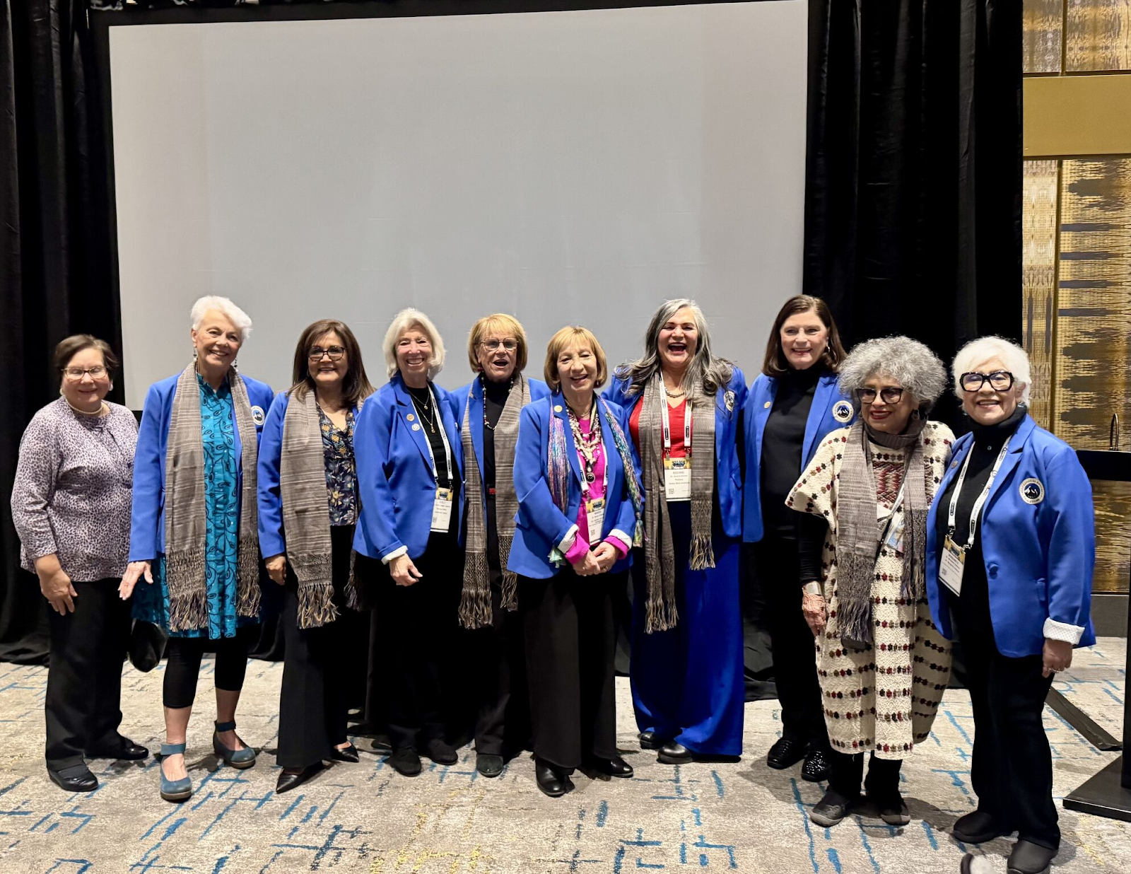 A group of women standing togetherAI-generated content may be incorrect.