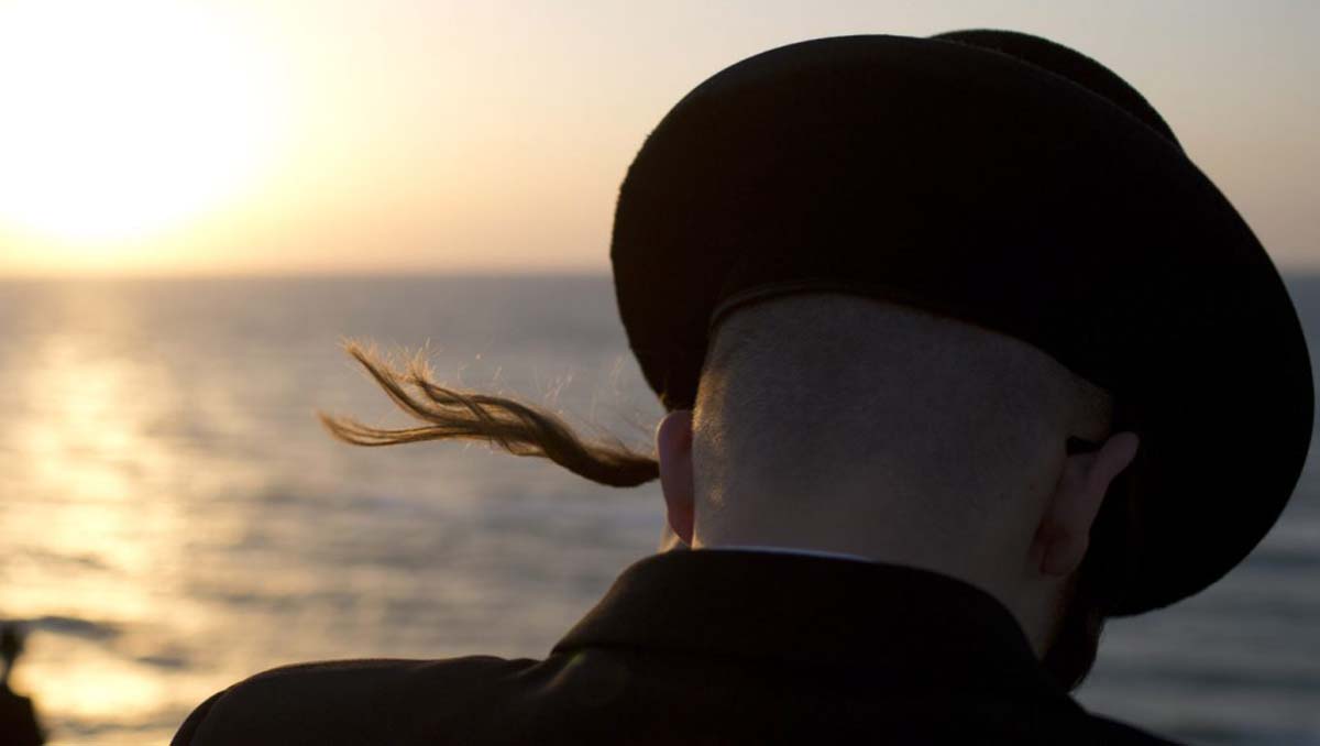Ultra-Orthodox Jews of the Hassidic sect Vizhnitz gather on a hill overlooking the Mediterranean sea as they participate in a Tashlich ceremony in Herzeliya, Israel, Thursday, Sept. 12, 2013. Tashlich, which means 'to cast away' in Hebrew, is the practice 