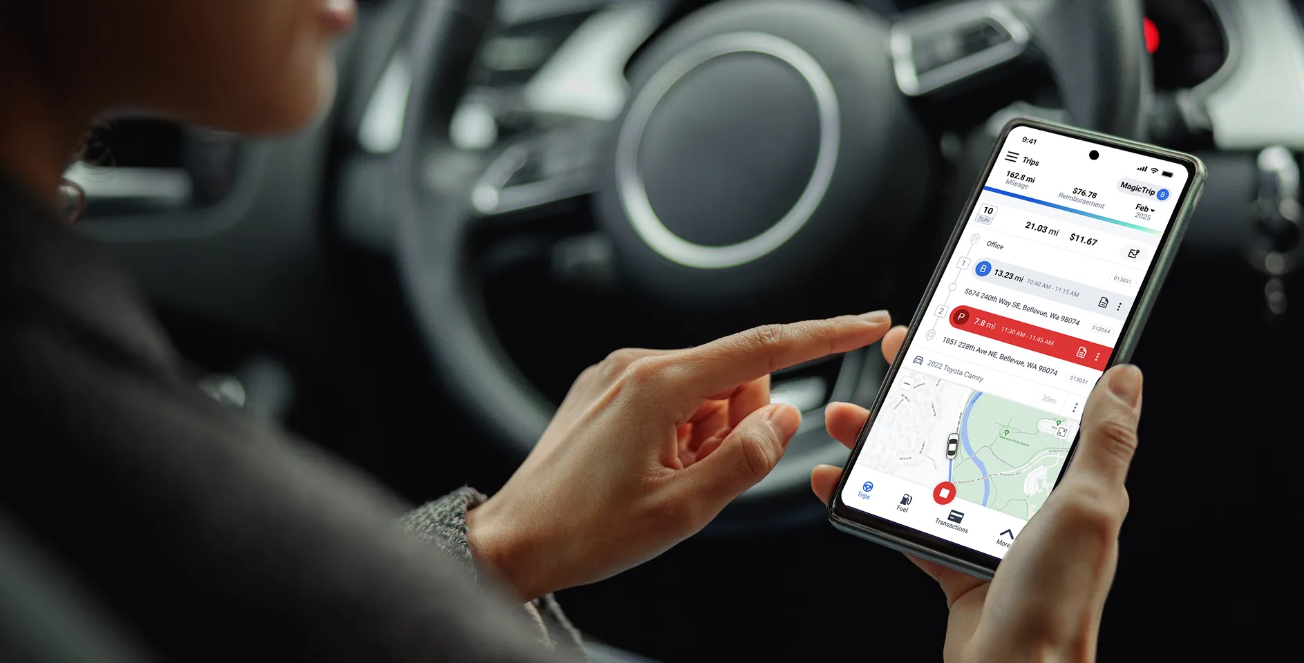 a person sitting in their car, looking at the triplog mobile app while trip is running, showing how mileage is tracked