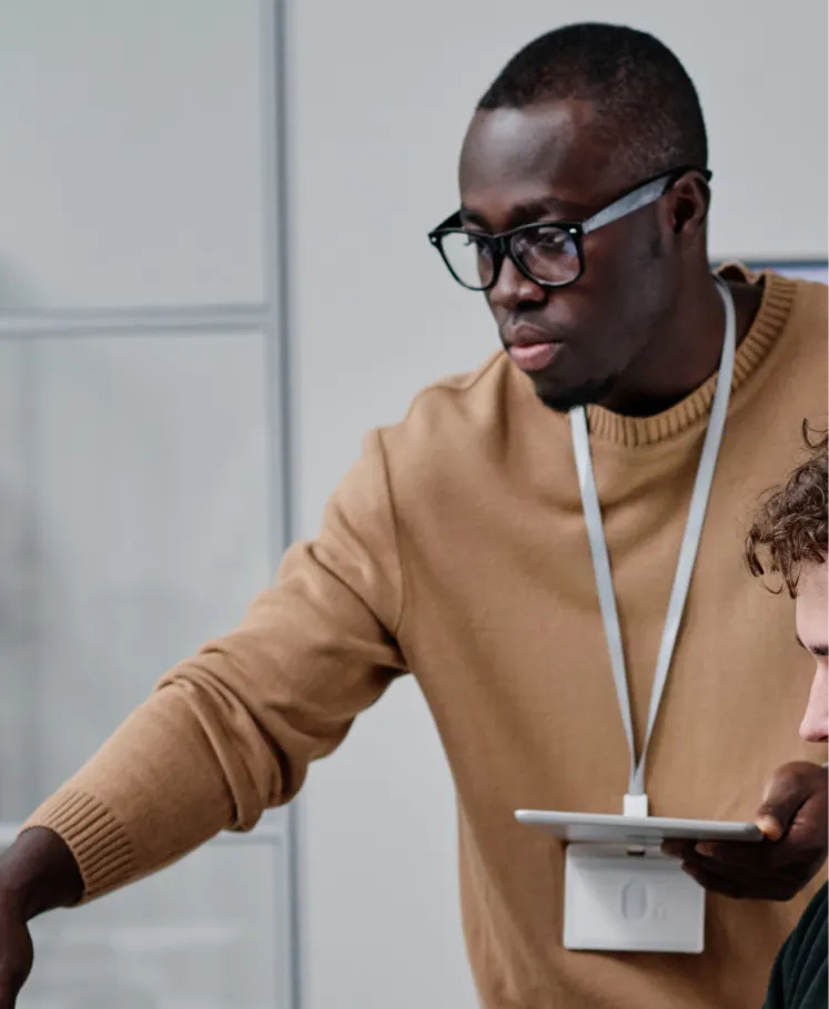 Technology professional using a tablet in an office