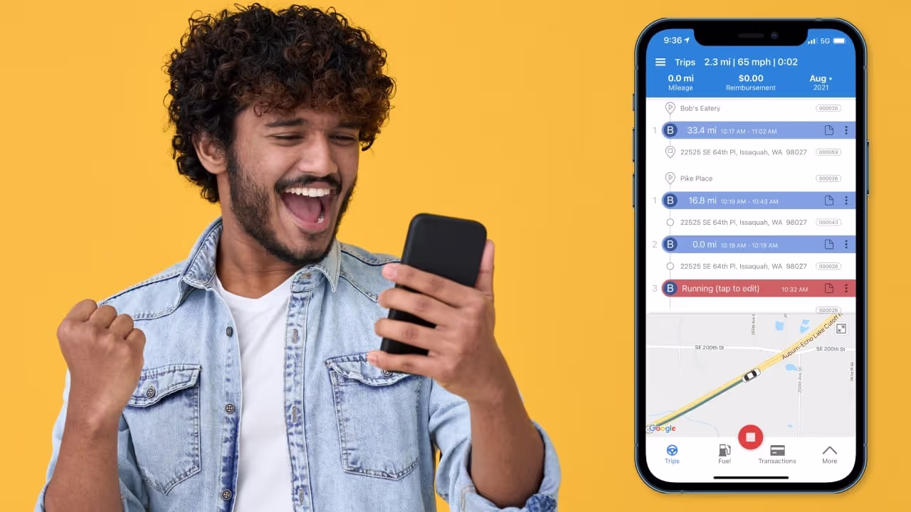 man holding phone happy to use mileage tracker app|person driving on road should they use a mileage tracker app