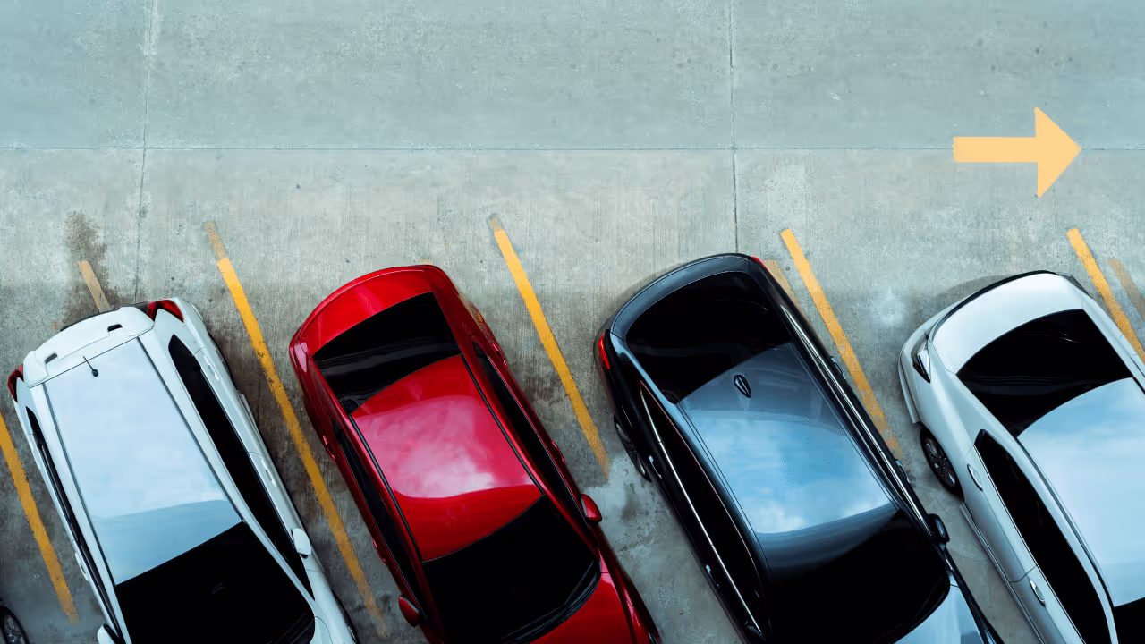 cars parked in a parking lot overhead photograph|cars parked photo of bumpers