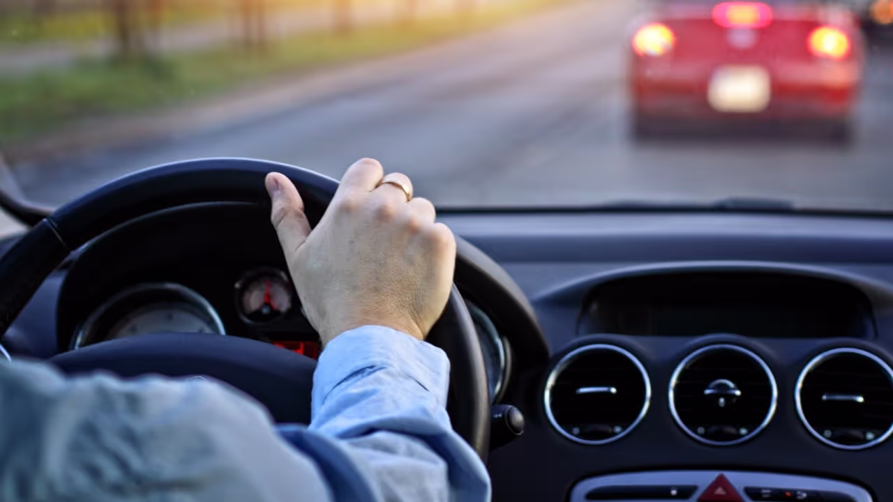worker driving company car for personal use|company car out in the city|young man driving company car||