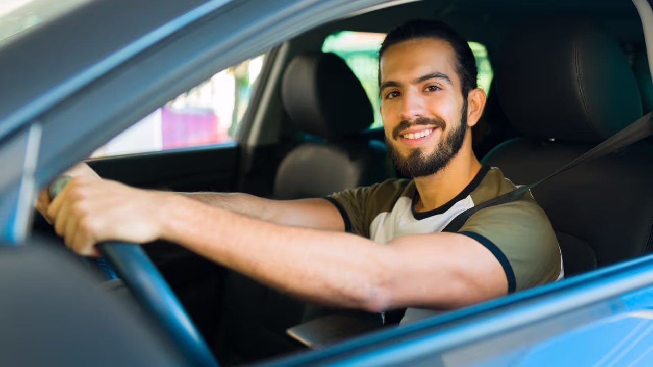 uber driver looking out of their window|people getting ready to drive for uber|person driving their car, maybe an uber driver