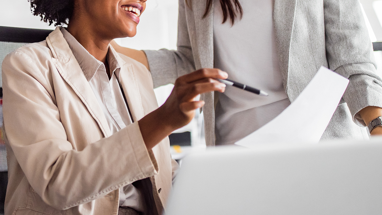 team at computer setting up their accountable plan