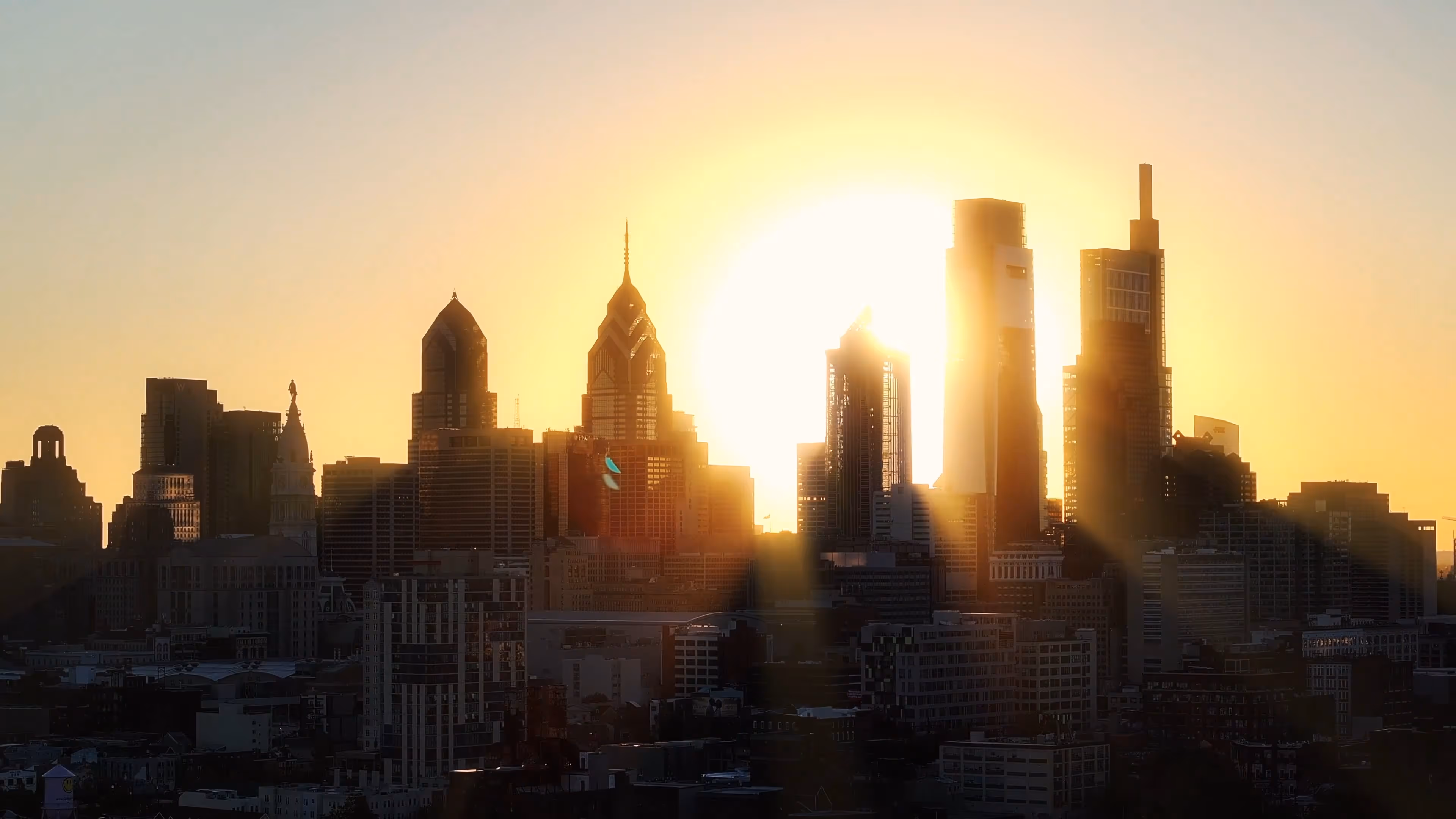 sunset rise through skyscrapers 