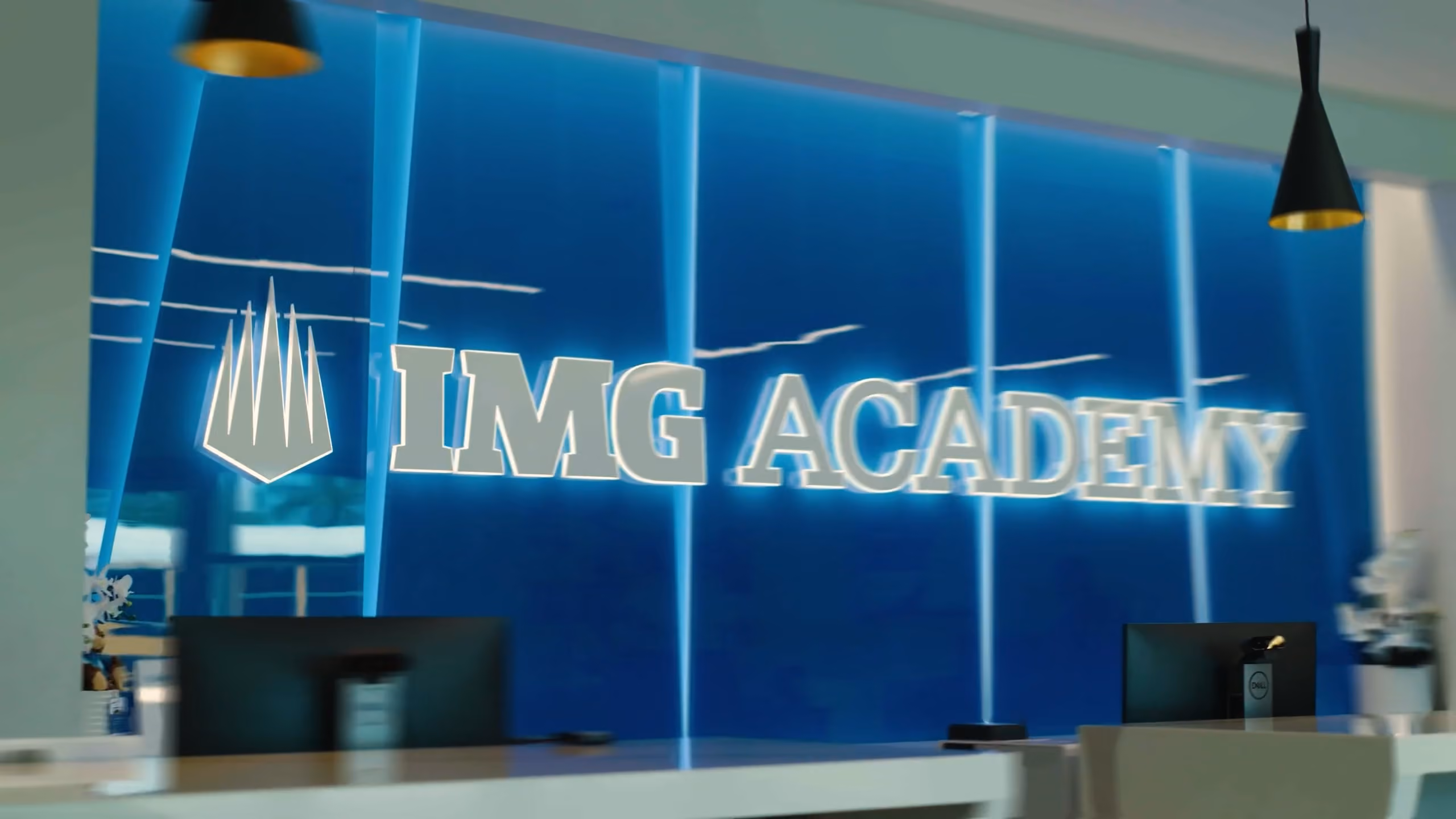 the entrance desk of a modern sports academy 
