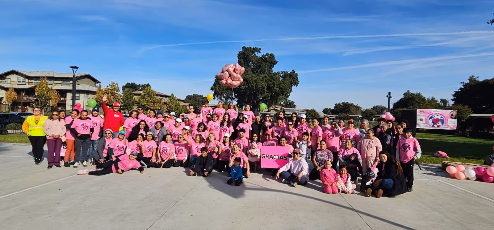 Corazon Latino Team in a event celebrating with a community.