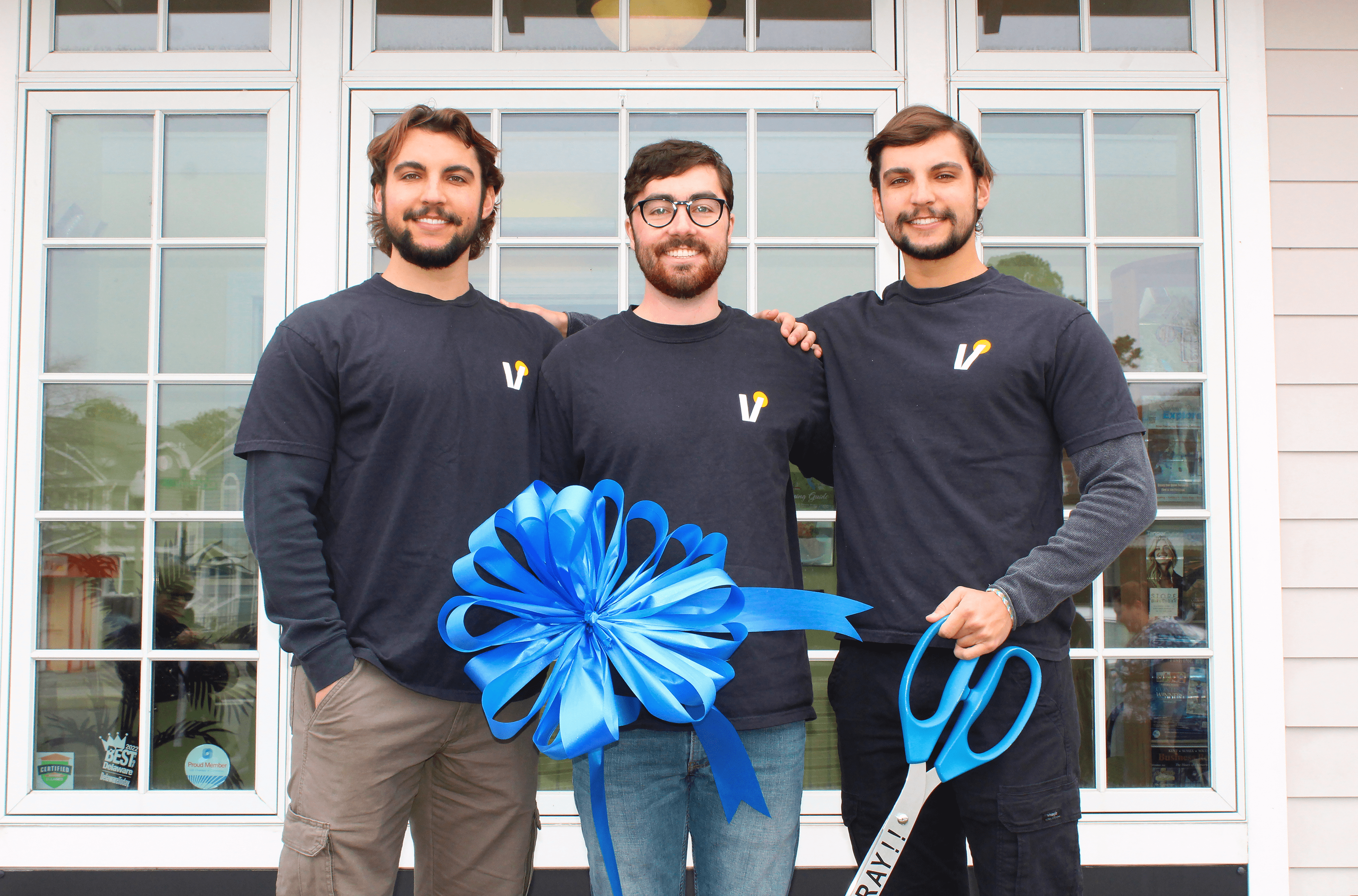Ryan Alex and Kyle of Vivid Creative Studio ribbon cutting in Rehoboth Beach DE