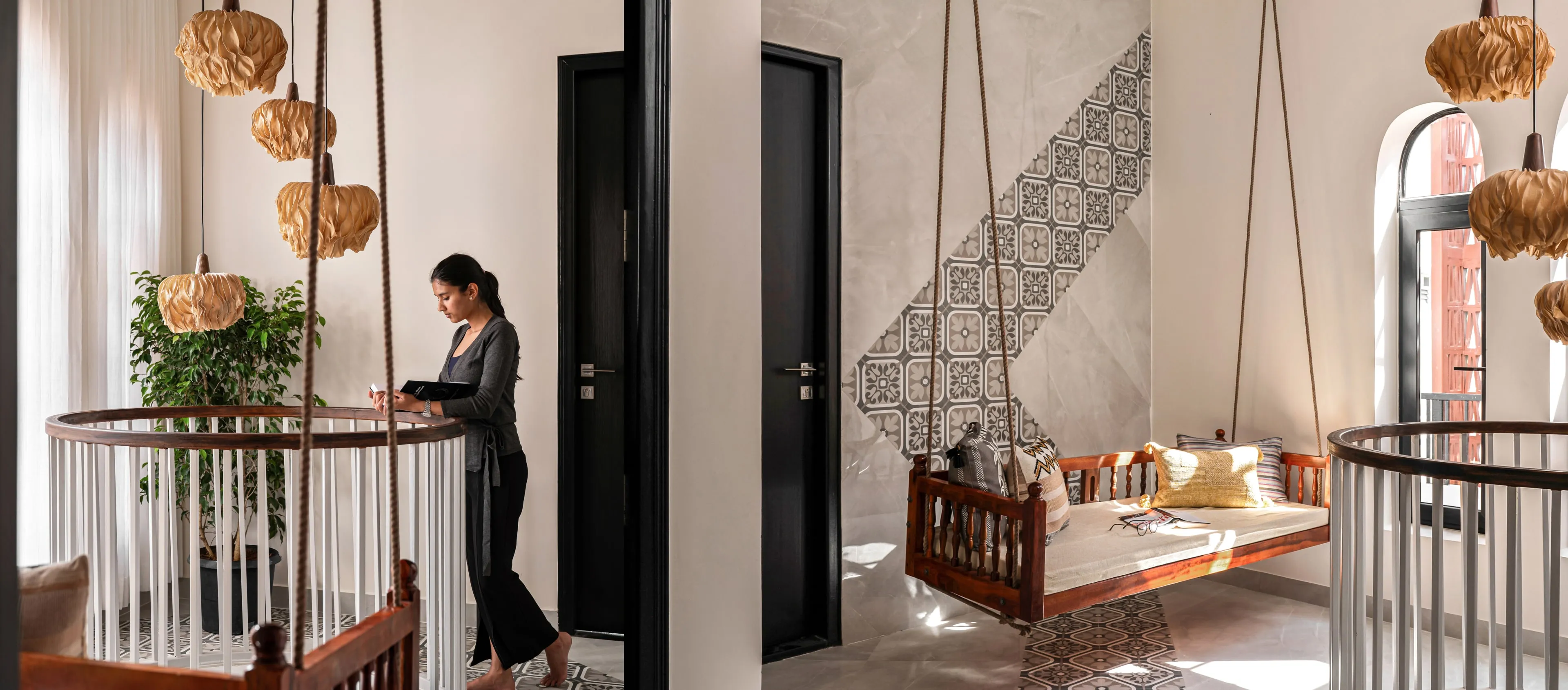 Woman standing barefoot near a modern wooden swing seat inside a bright, stylish room with patterned tile flooring and hanging pendant lights.
