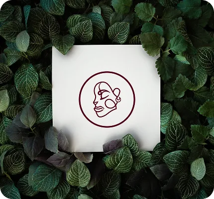 FEM Management logo on a card surrounded by green leaves