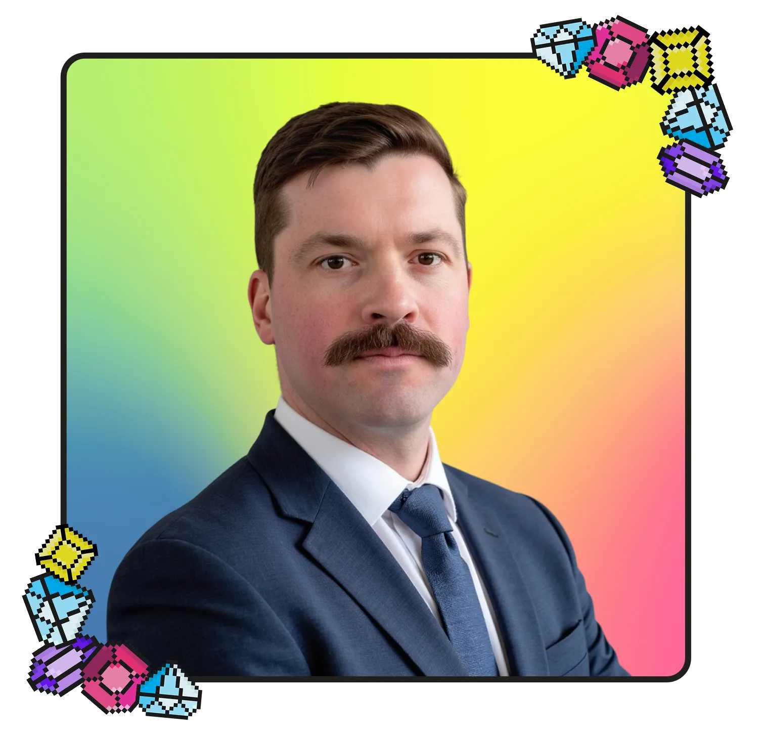 Man with a mustache wearing a dark blue suit, white shirt, and blue tie, posing with arms crossed against a colorful gradient background with pixelated gem decorations in corners.