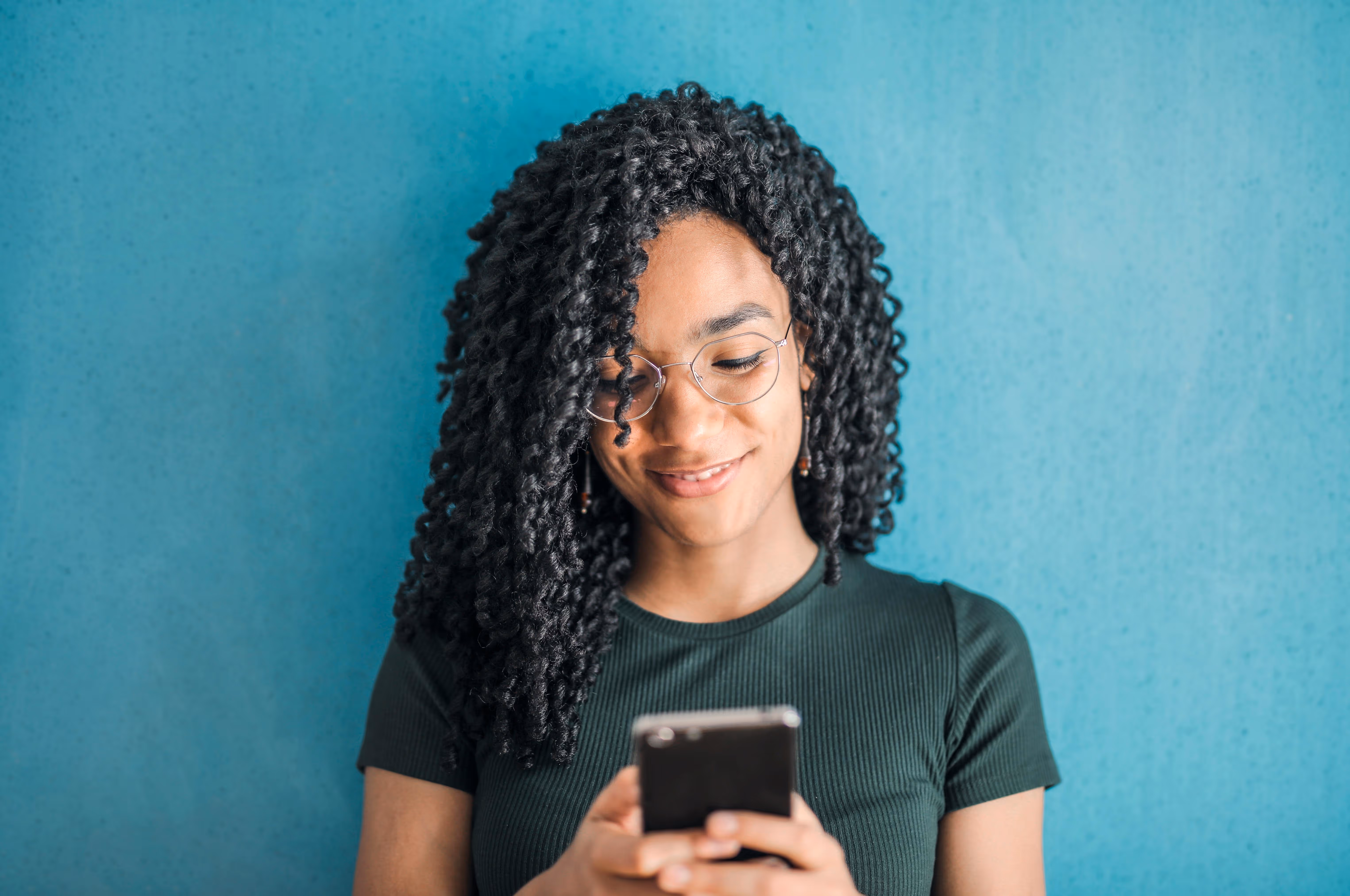 Young woman looking at christian apps during surge in revival across US