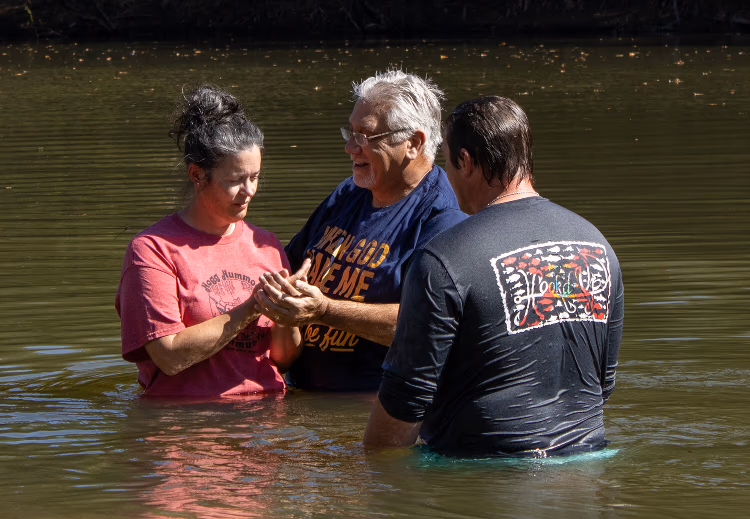 Woman baptized in river