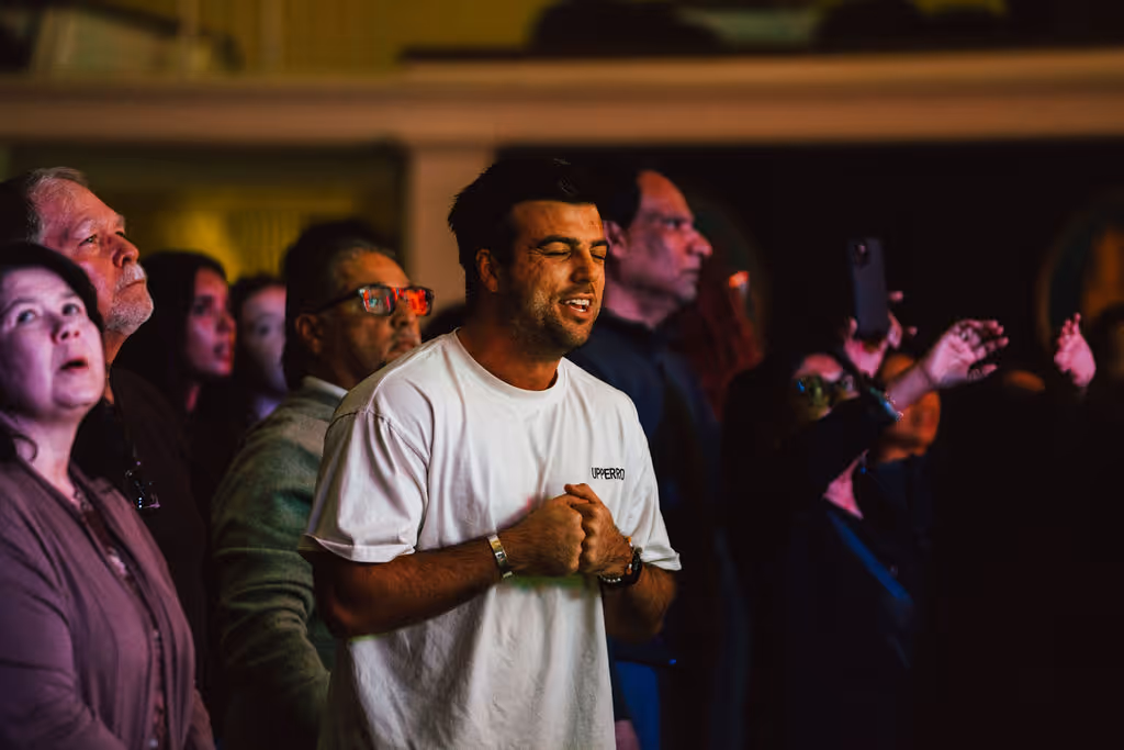 Young man worshipping at AWAKE DC