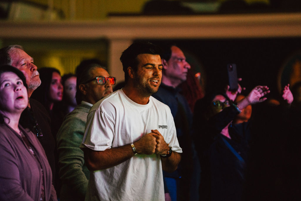 Young man worshipping at AWAKE DC