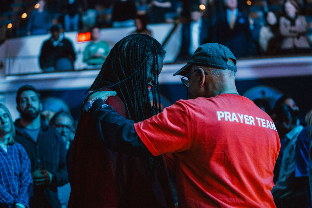 Woman receiving prayer