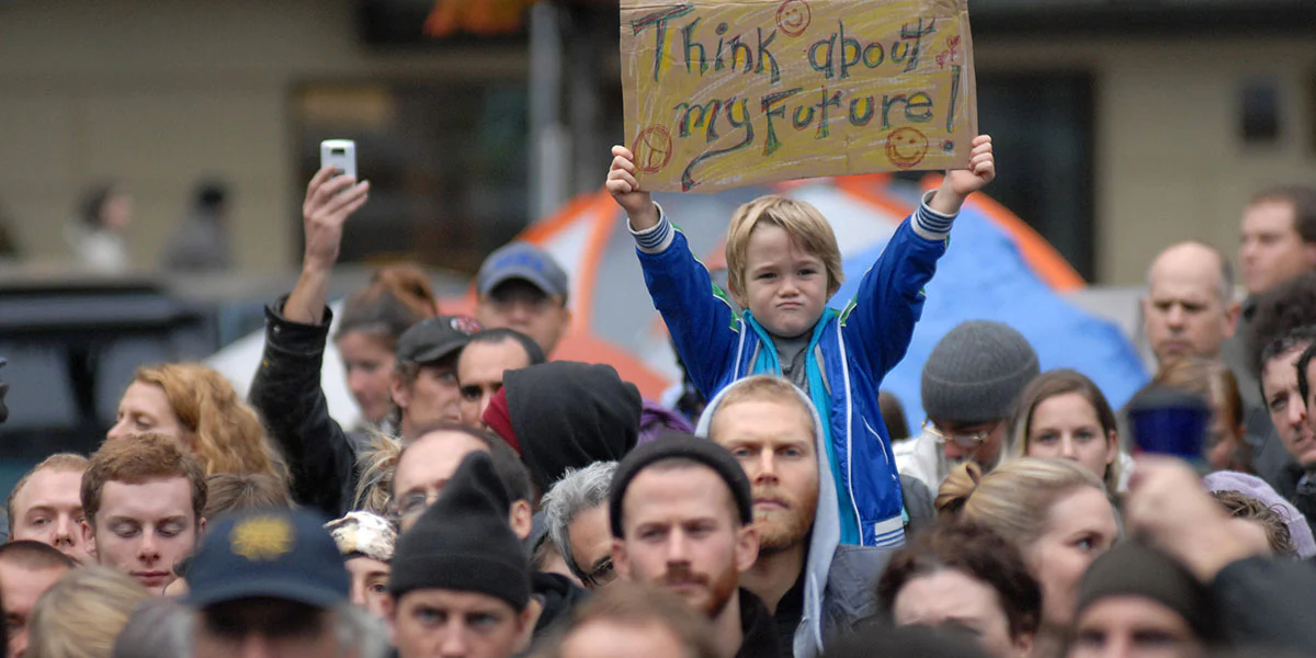 Young boy on shoulders.