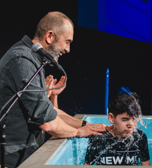 Young man being baptized.