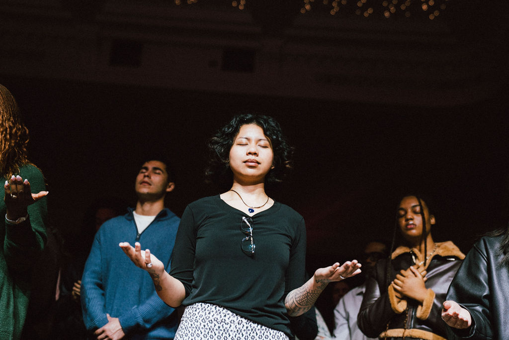 Woman worshipping at AWAKE DC