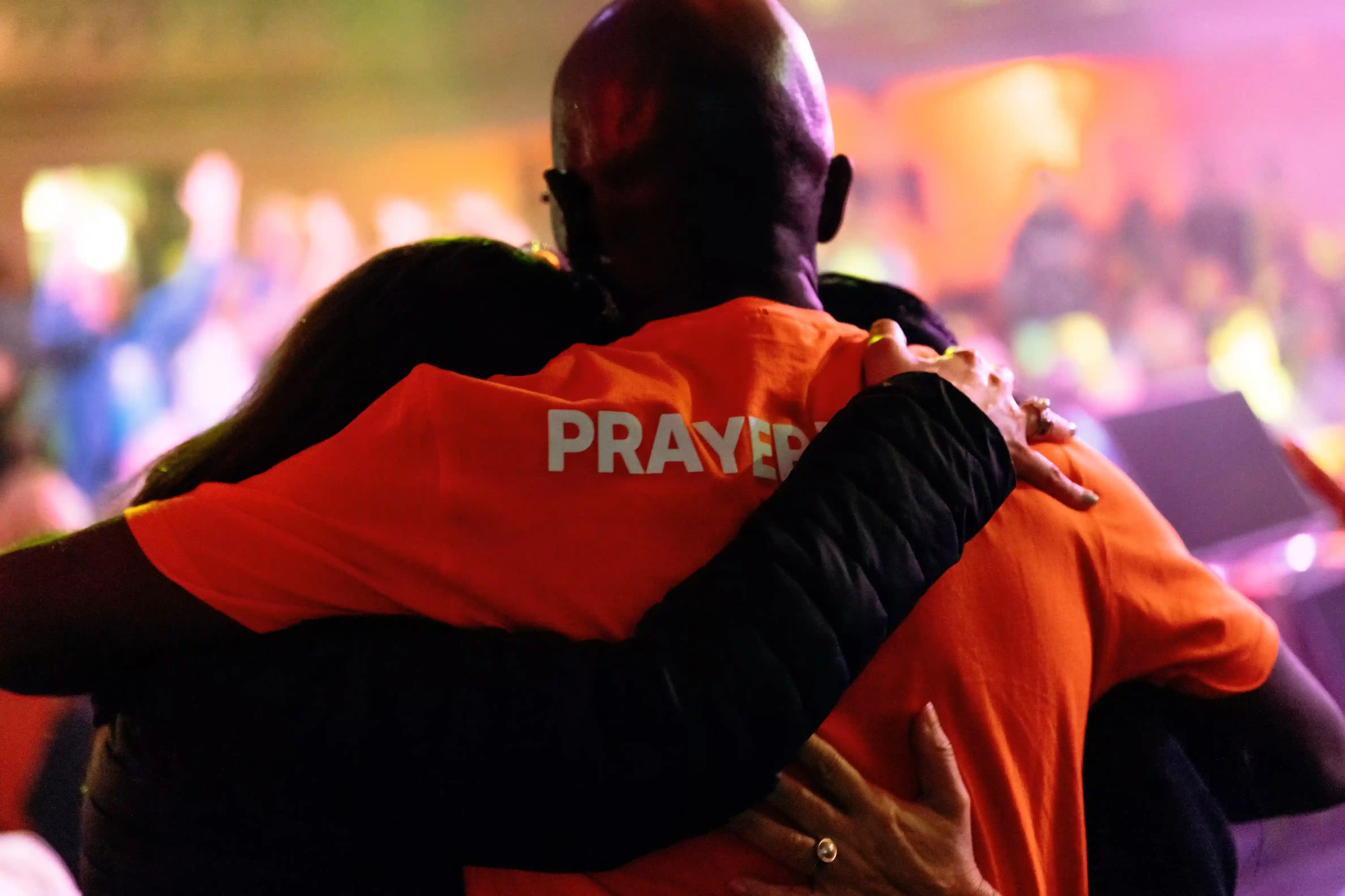 Prayer team member embracing an attendee at AWAKE America Boston rally