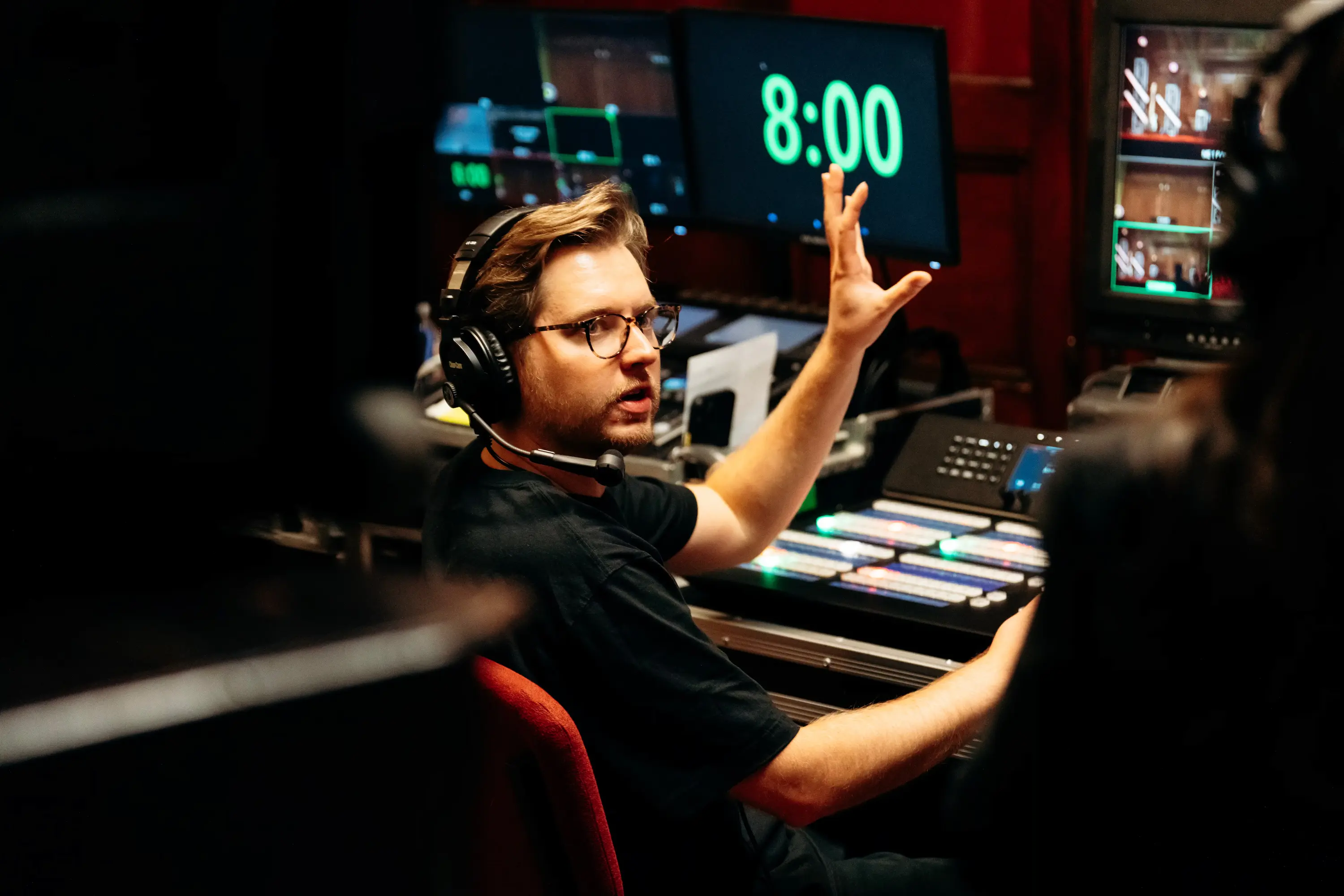 Production crew member at video mixing console during AWAKE America Boston rally
