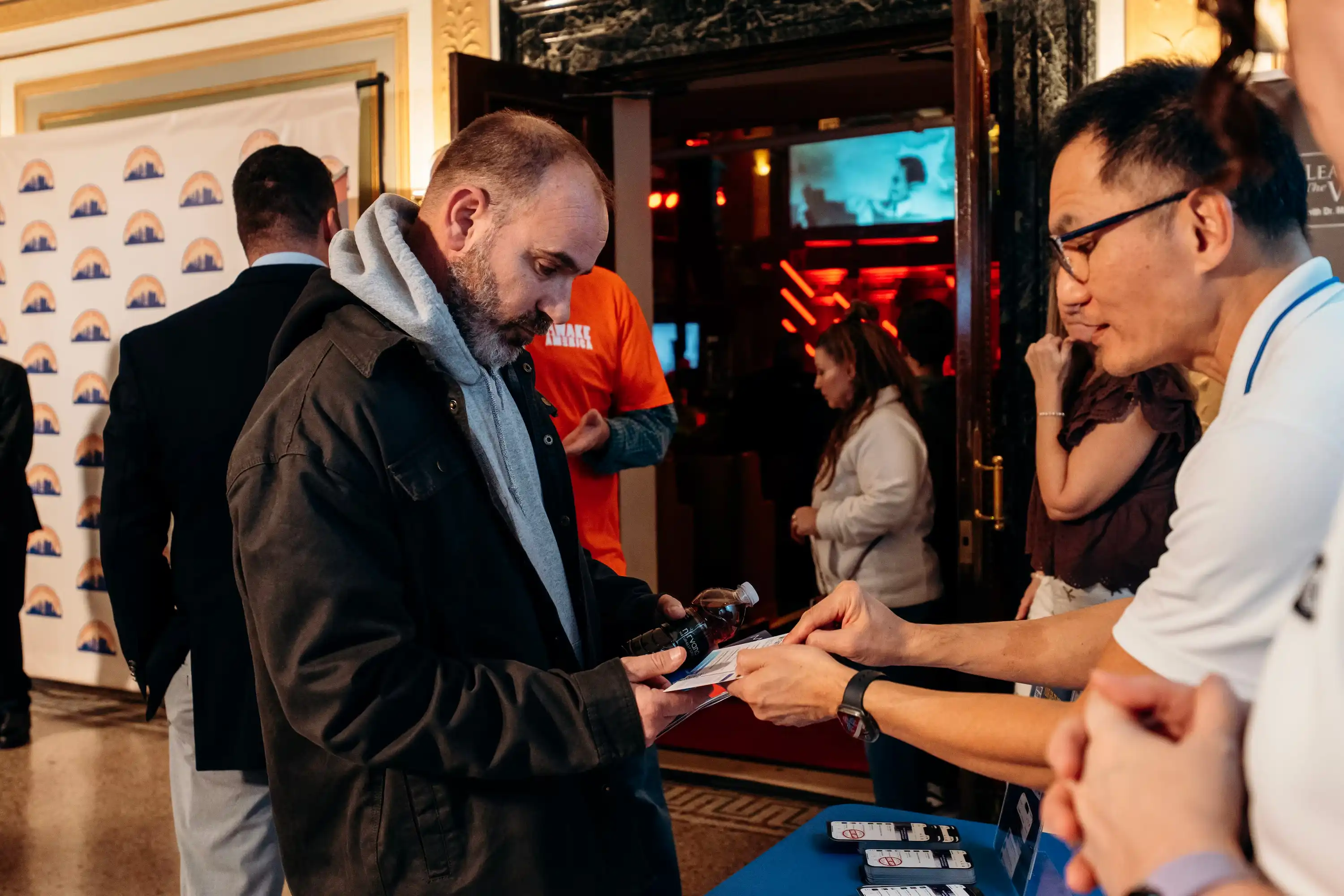 Attendee checking in at AWAKE America Boston rally registration table