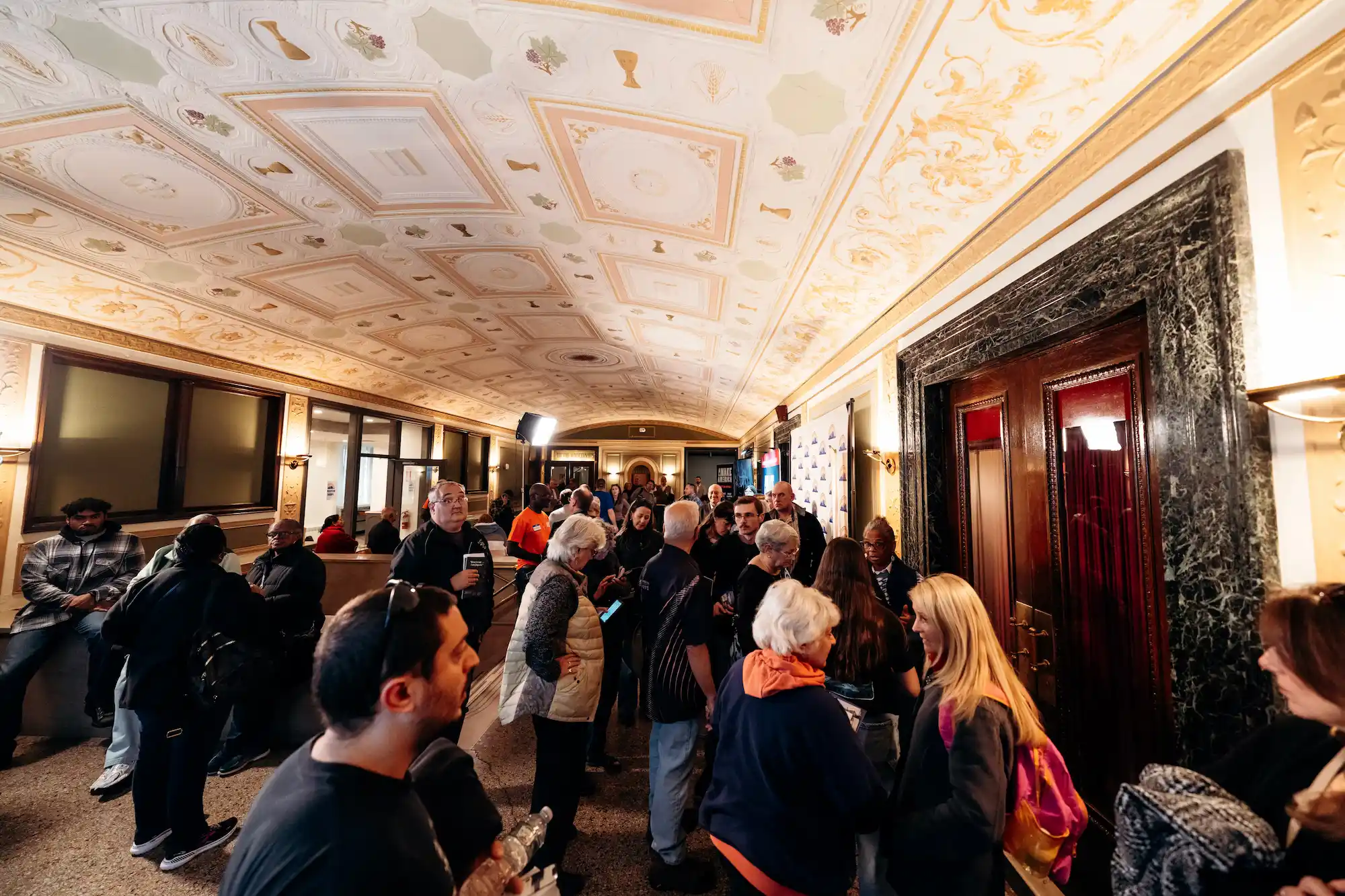 Attendees gathered in the ornate lobby of Tremont Temple at AWAKE America Boston rally