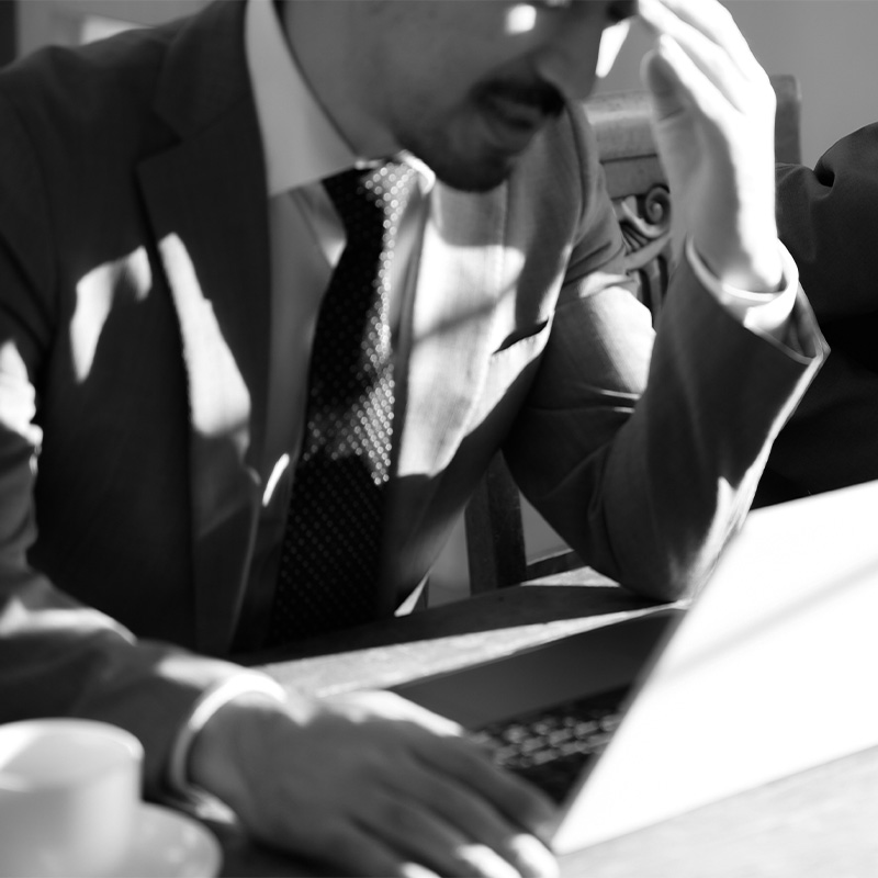 Employee looks worried after reading poorly communicated news about a company restructure