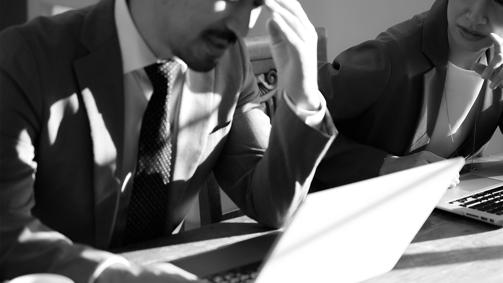Employees looks worried after reading poorly communicated news about a company restructure