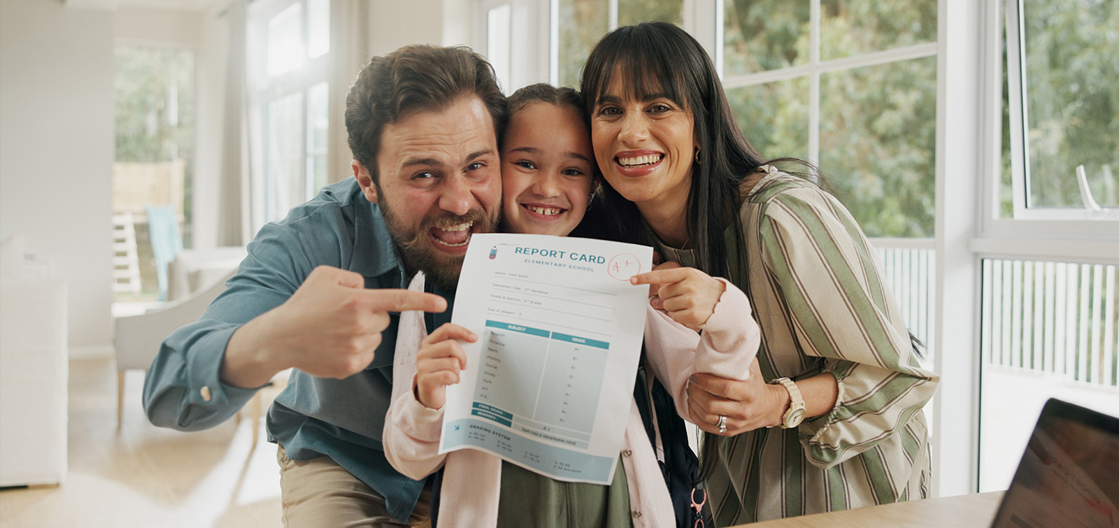 Parents and their child proudly show off the child's report card - a reference to scoring an organisation's internal comms