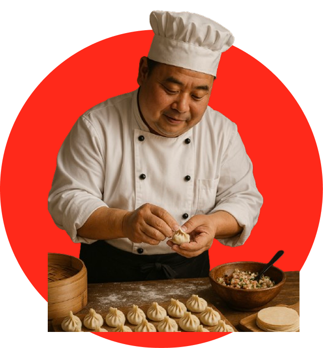 Chef in a white uniform folding a dumpling.