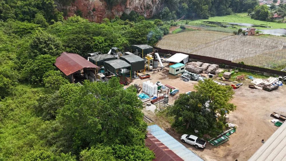 Our Ipoh site. Pyrolysis/torrefaction site in the foreground. Mountains and trees in the background.