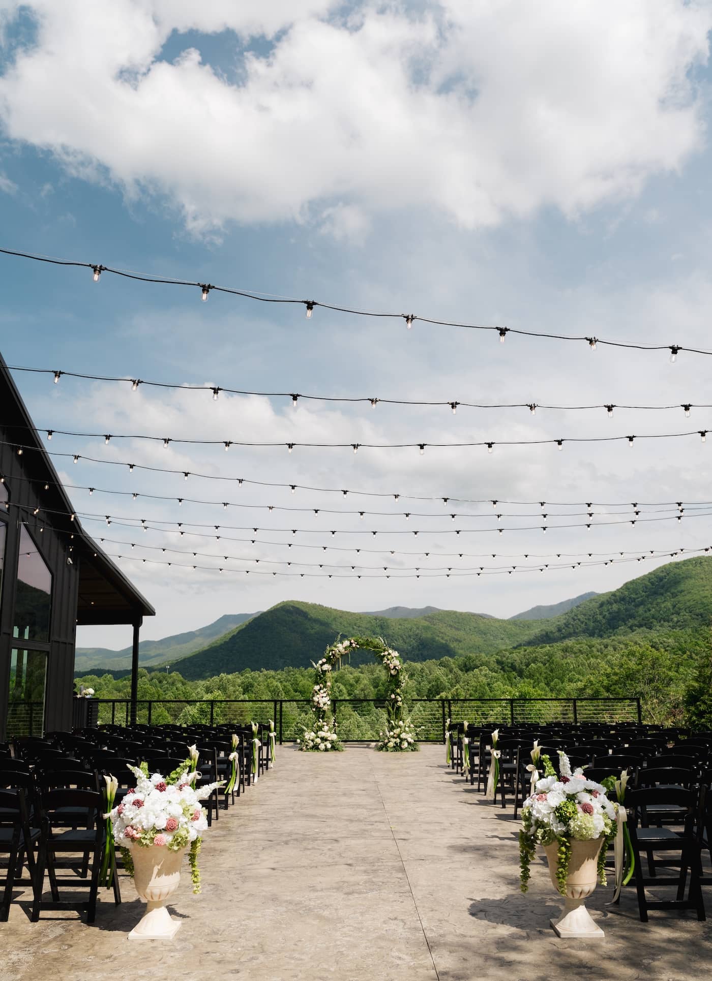 Outdoor wedding ceremony setting at Trailhead Venues with mountain backdrop.