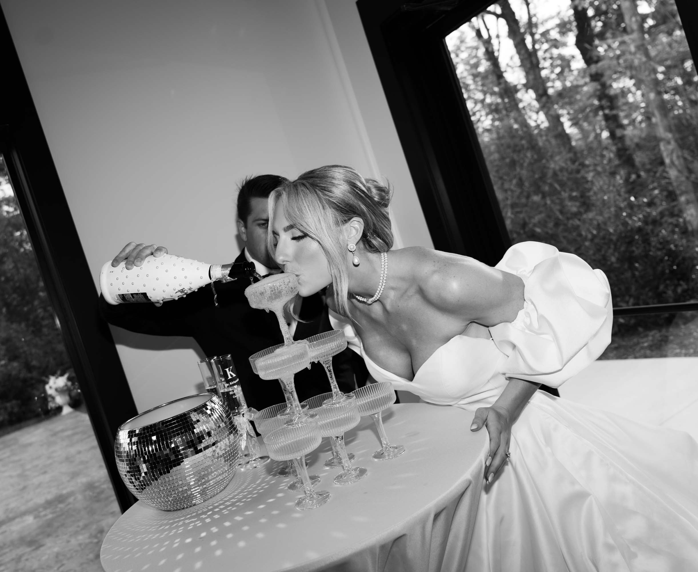 Bride in white dress watches her bouquet toss at a Gatlinburg wedding venue.