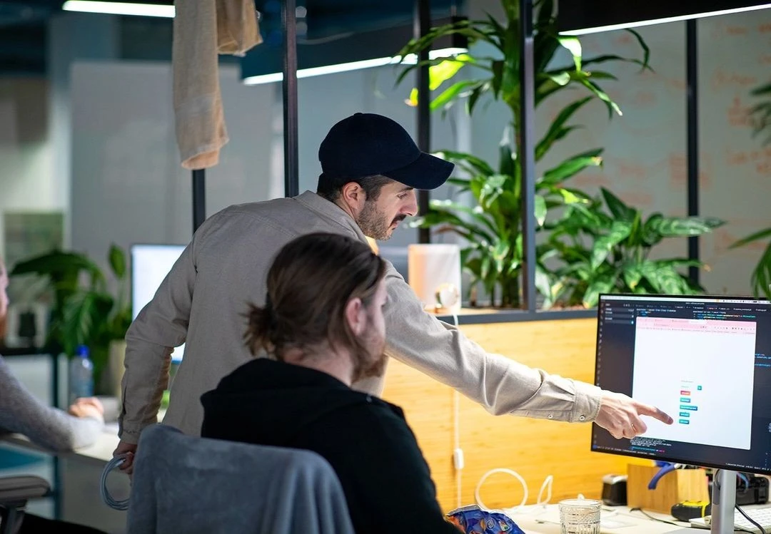 Trackap team members discussing our white-label platforms and applications