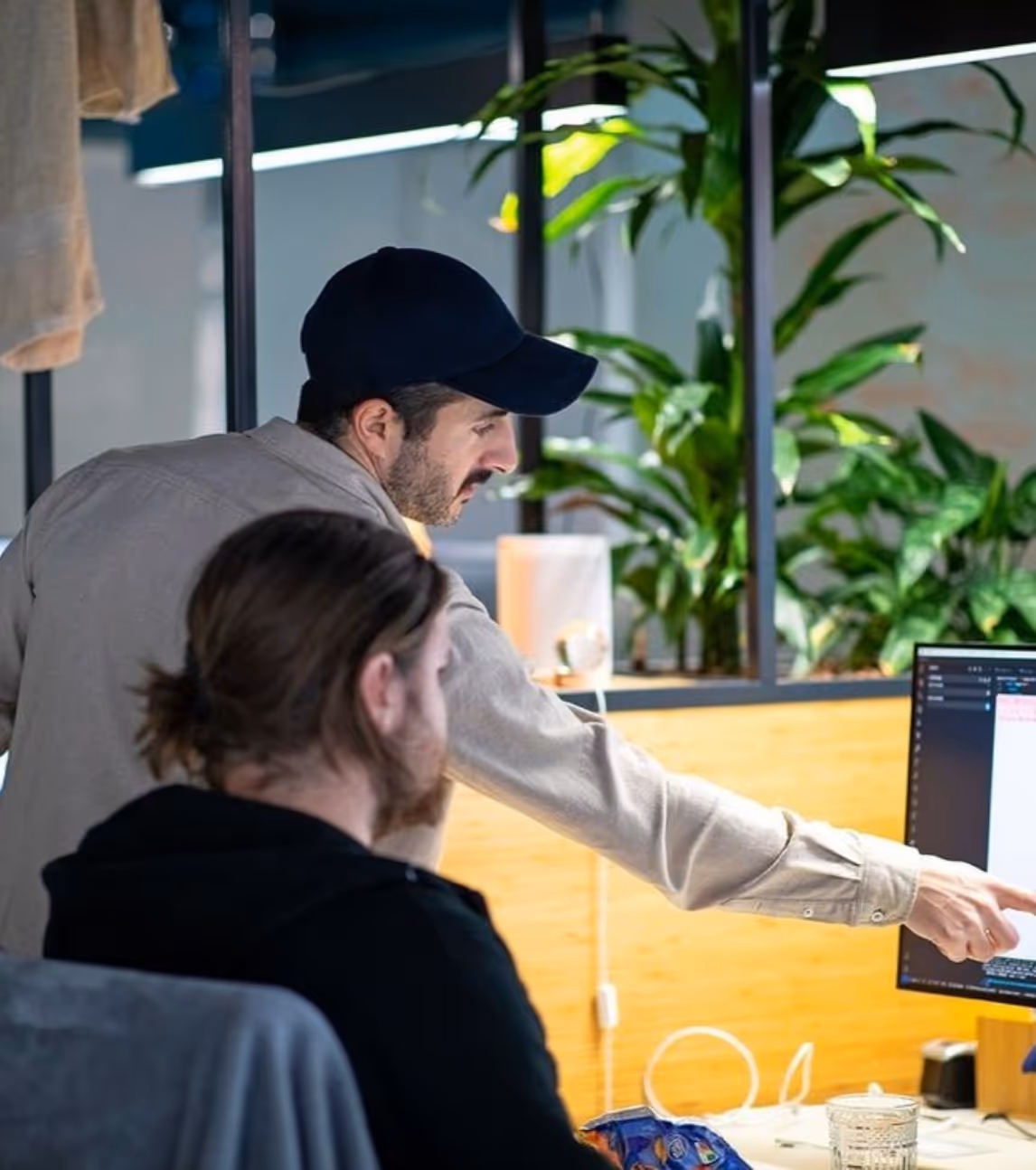 Trackap team members discussing our white-label platforms and applications