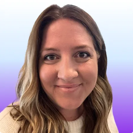 Headshot of a smiling woman with blonde hair wearing a cream sweater, against a blue and purple gradient background.