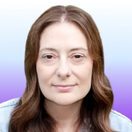 Headshot of a woman with light brown hair, wearing a denim jacket, against a blue and purple gradient background.