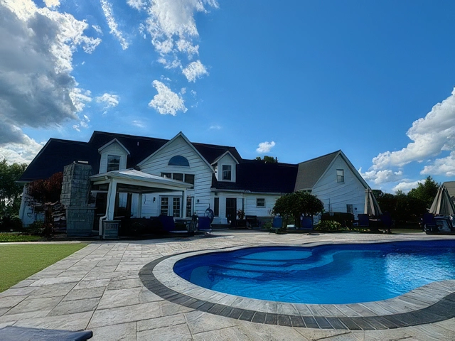 Pools & Water Features: Custom outdoor pool and decorative water feature designed for a residential landscape in Ohio