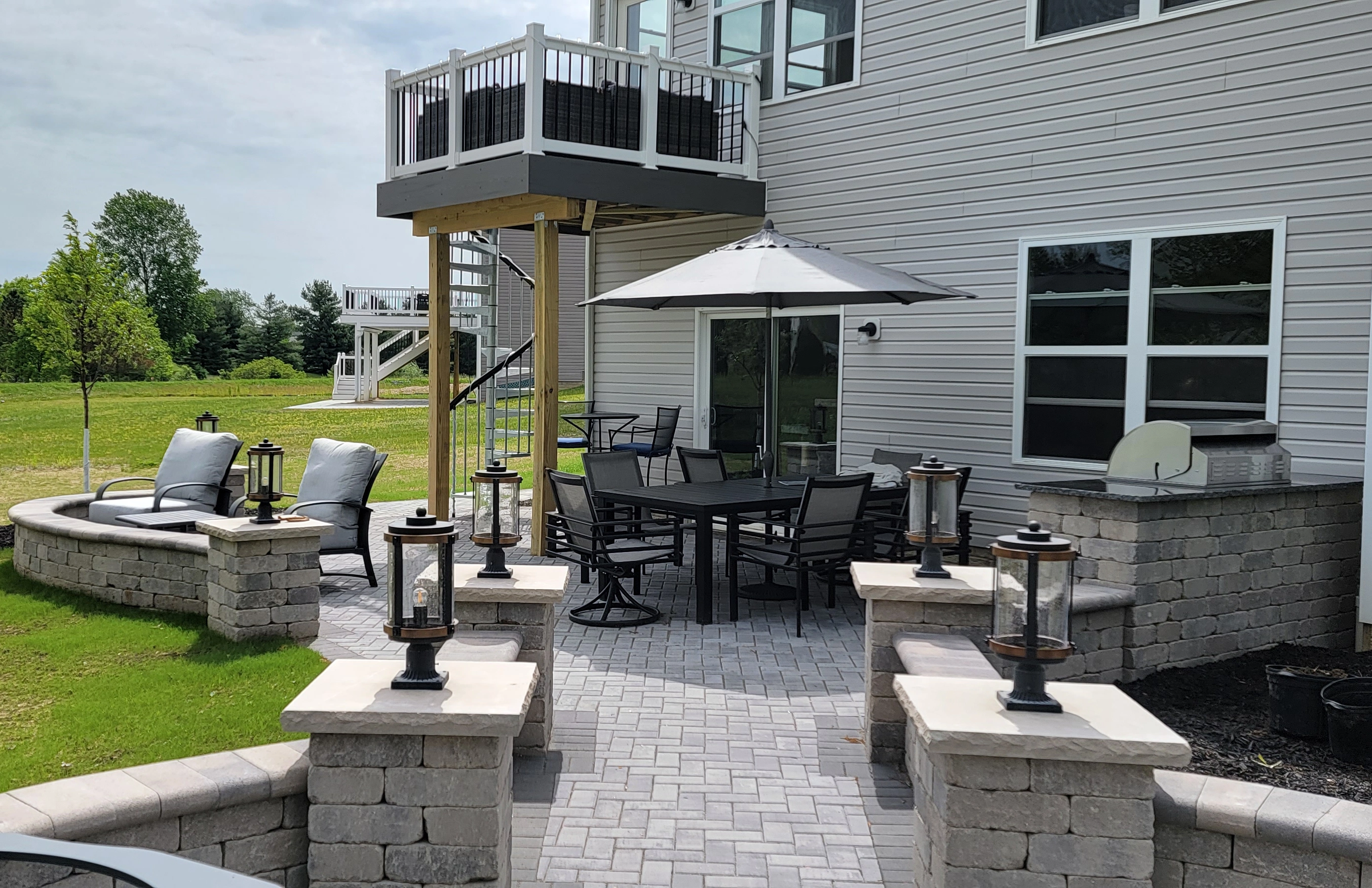 Patio & Hardscapes: Custom backyard patio and stone hardscape installation by Mueller Landscaping in Northeast Ohio