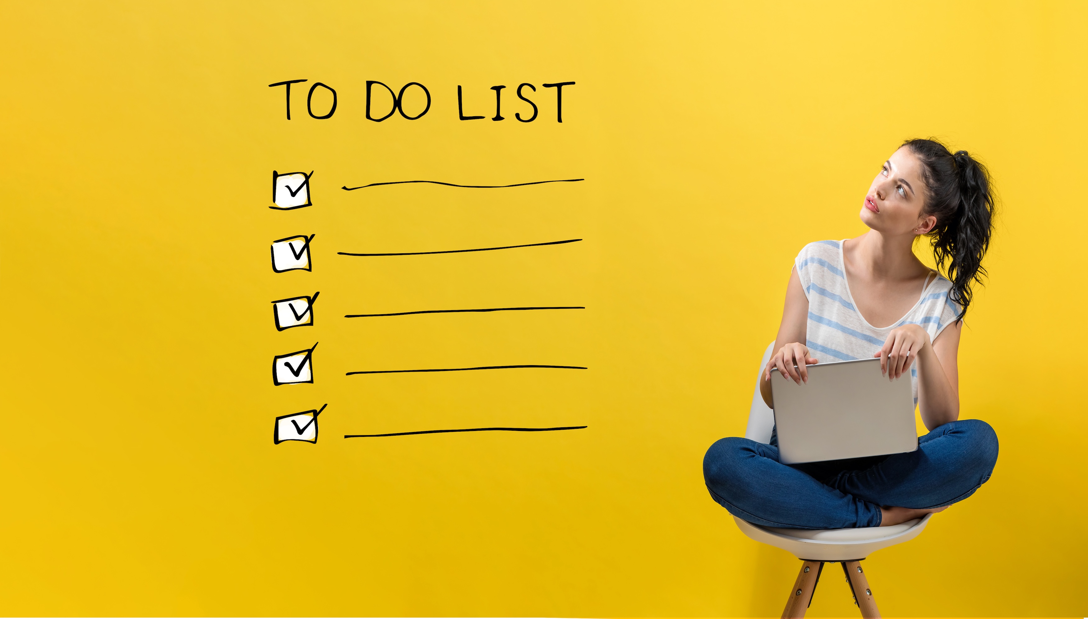 to do list with a yellow background and lasy with computer looking at the writing