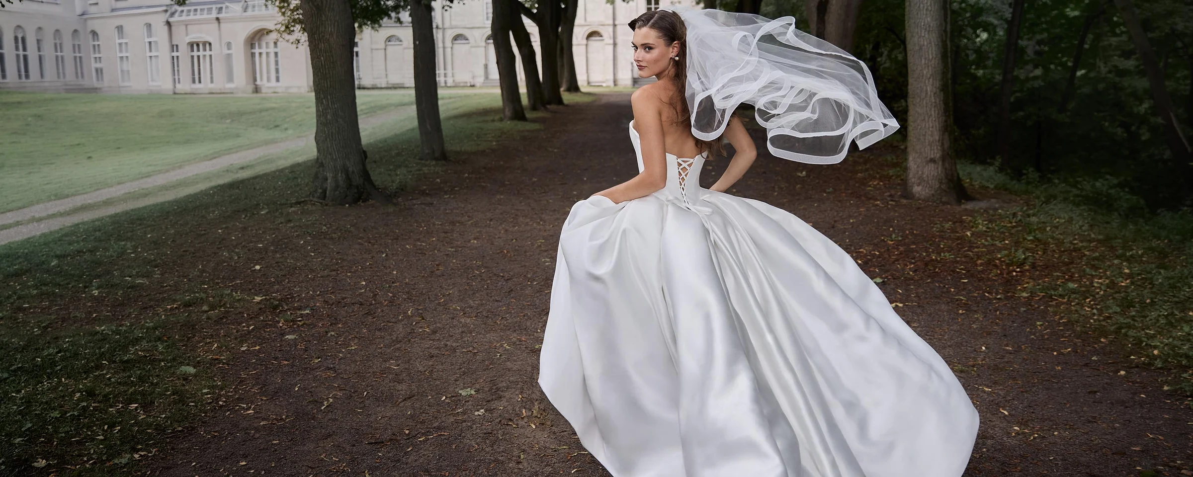 Paloma Blanca bridal gown featuring strapless sweetheart neckline and full A-line skirt; view collection button.