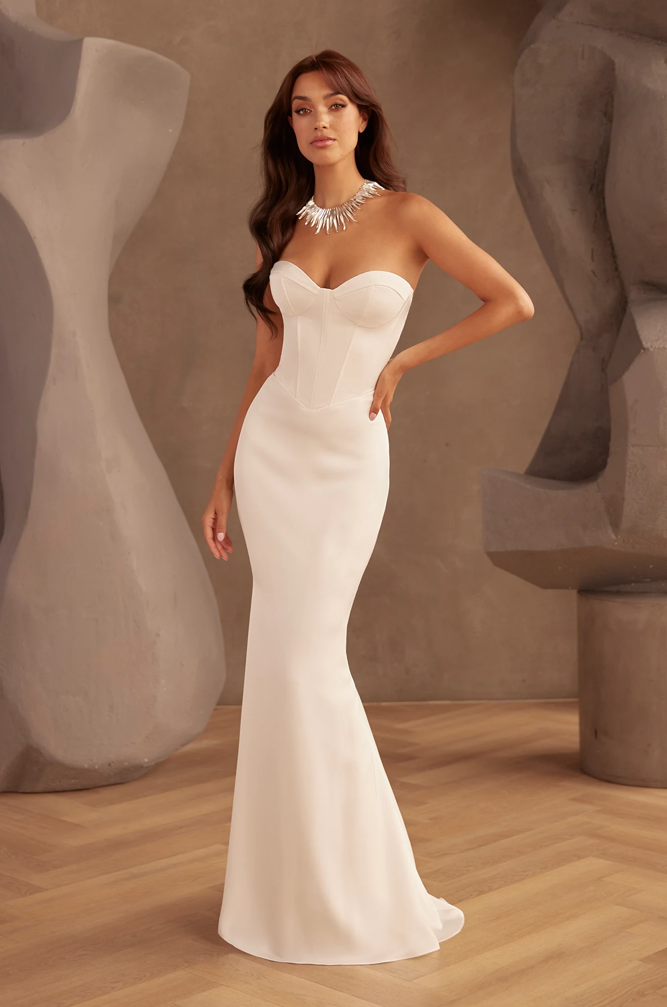 Front view of sweetheart neckline wedding dress with structured corset bodice and fitted mermaid silhouette.